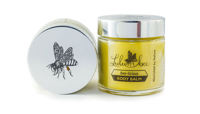 Bee-licious Body Balm product in glass jar and side lid view