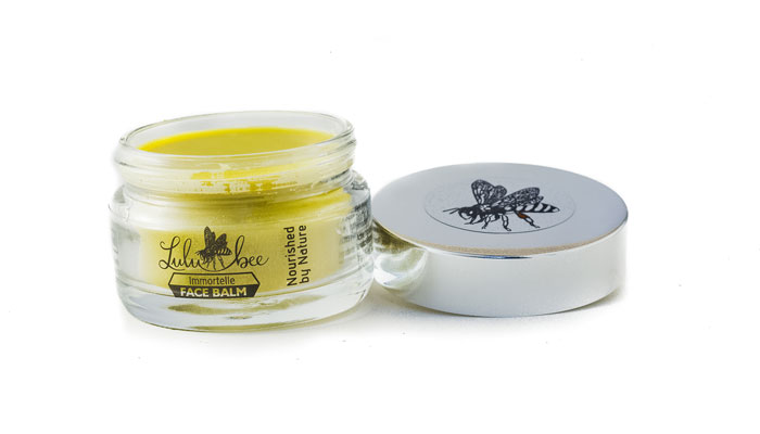 Immortelle Face Balm in glass jar with lid off